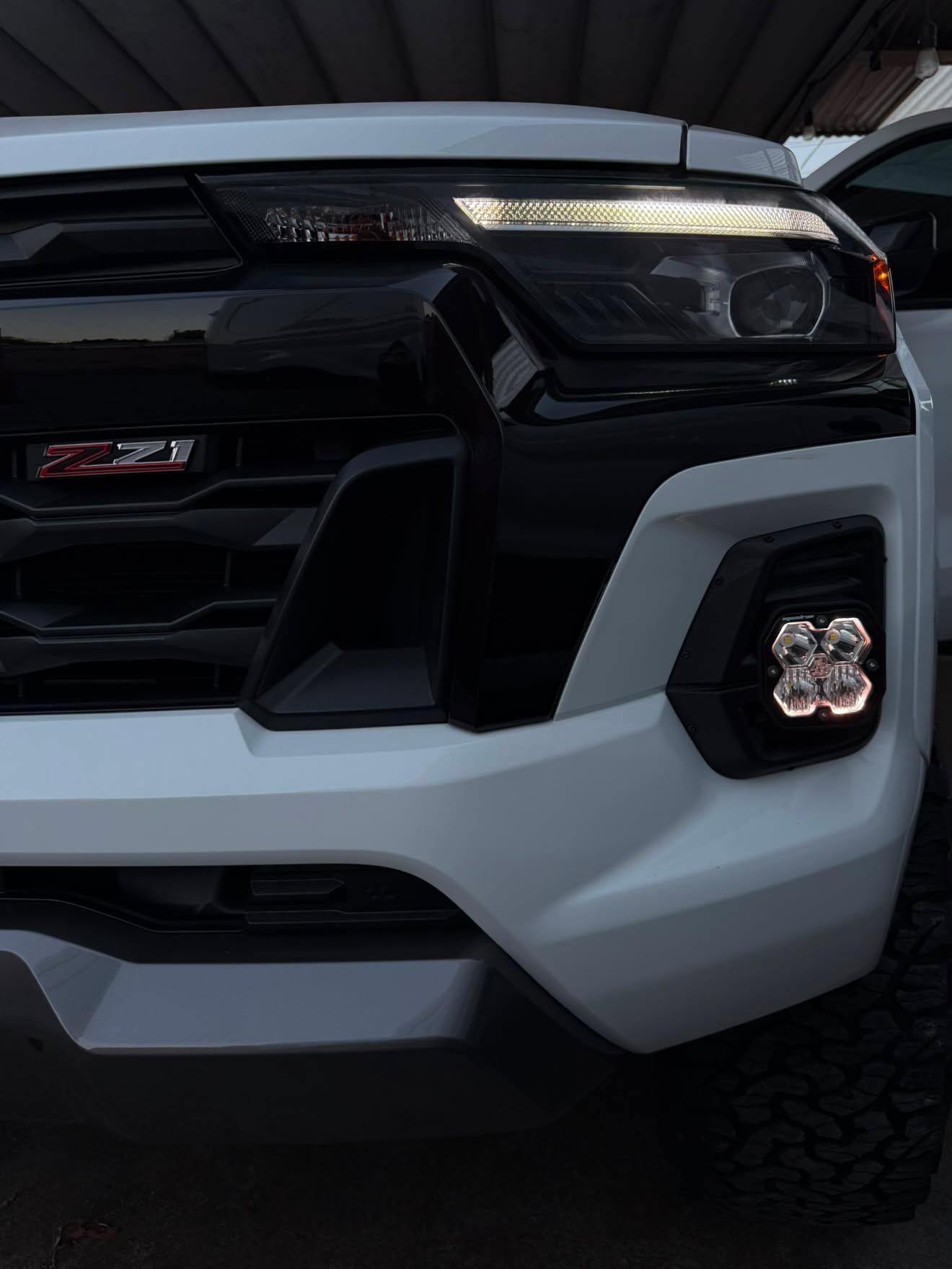 +2024 Colorado LT/TrailBoss vent cover (ASA Matte Black) + Squadron Sport 2.0 Black LED Auxiliary Light Pod Pair